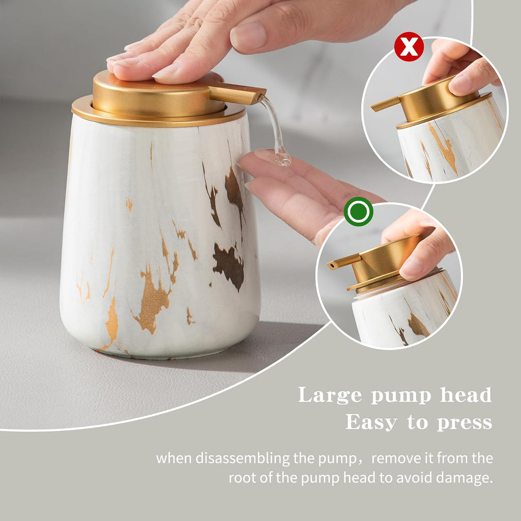 Pressing the large gold pump head of the ceramic soap dispenser